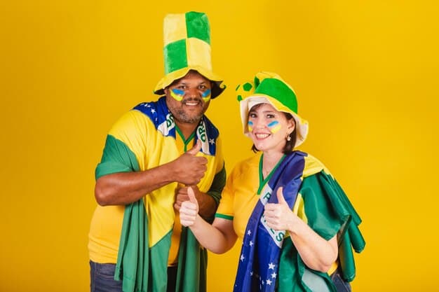 A diverse group of students, including a Brazilian flag bearer, participating in a university parade, showcasing international diversity.