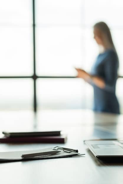 A professional setting with a blurred background, highlighting a non-resident individual confidently presenting necessary documents (passport, utility bill) to a bank representative at a modern bank branch for opening a bank account.