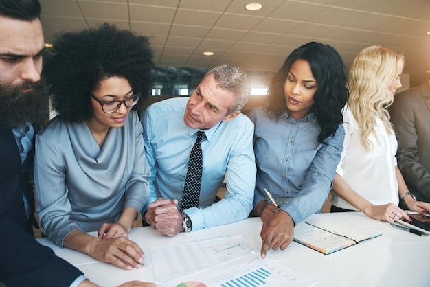 A close-up photo of a diverse group of people sitting at a table in a bank, reviewing documents and discussing financial matters.