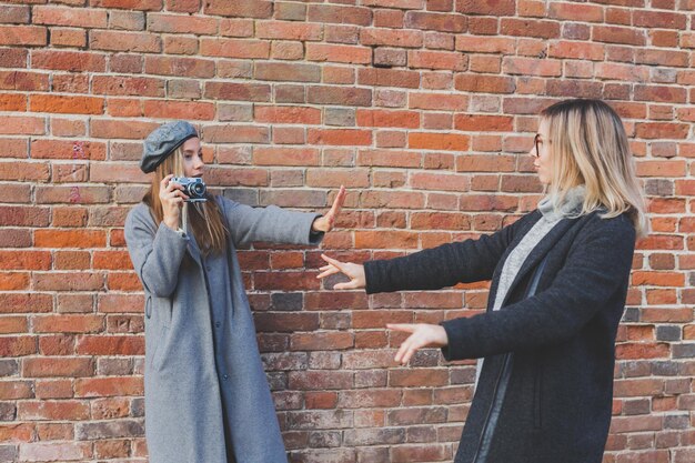 A split image showing, on one side, people peacefully protesting for stricter gun control laws, and on the other side, individuals at a gun range practicing their shooting skills, representing the divided opinions on gun ownership in the US.