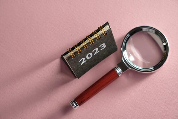A close-up of a calendar highlighting the year 2025 with a magnifying glass over it, next to a stack of tax forms and a pen.